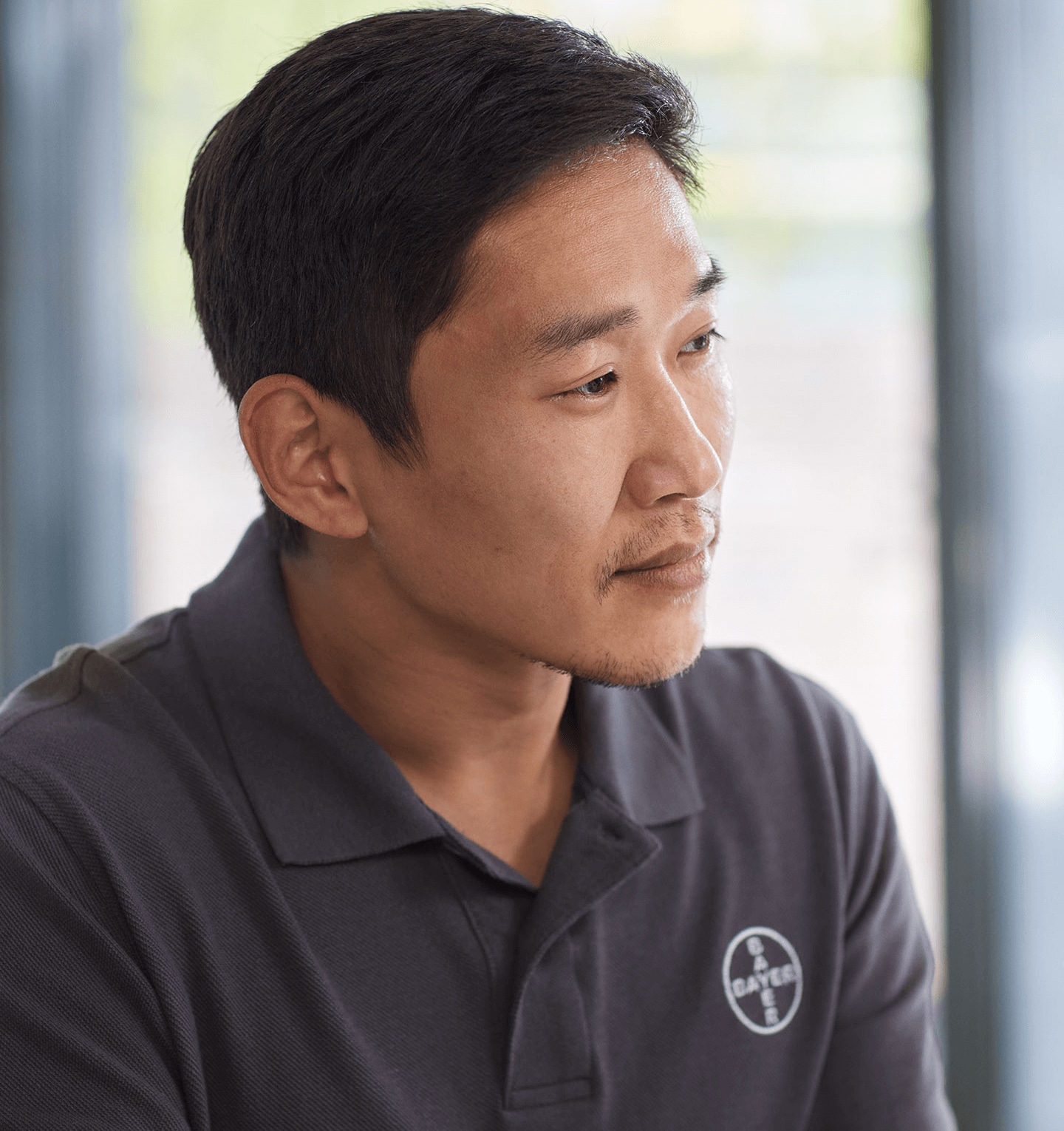 Bayer team member looking to the side