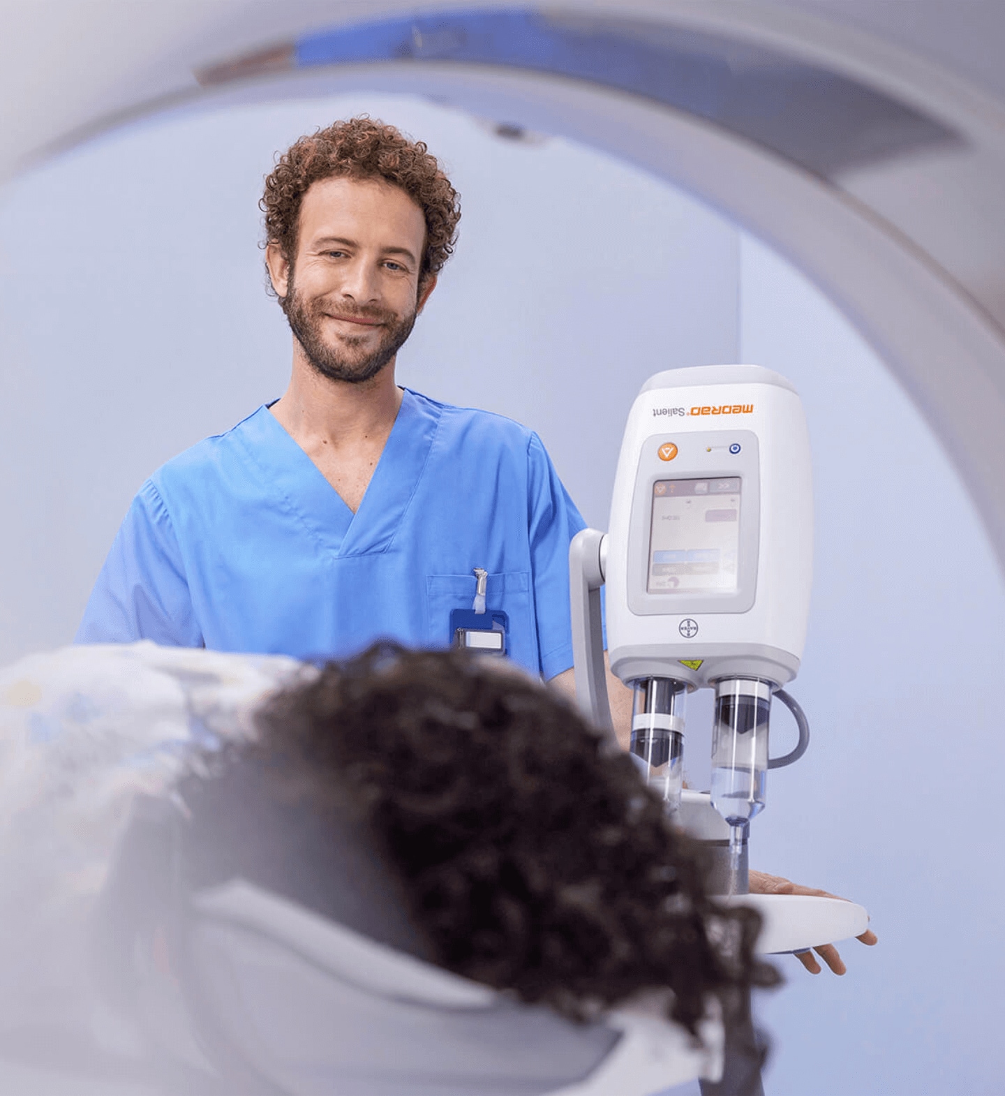 Radiographer prepares patient for scan