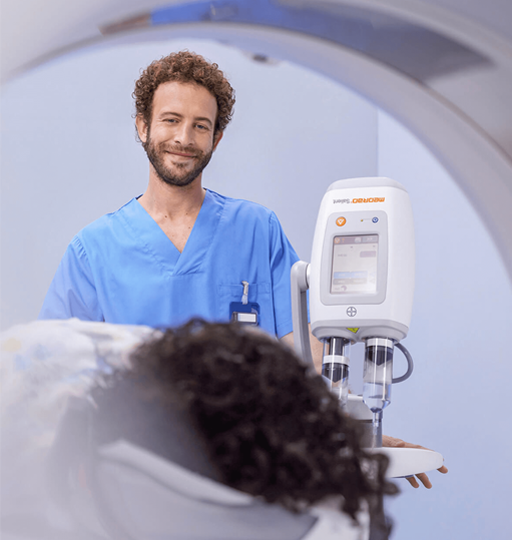 Radiographer prepares patient for scan