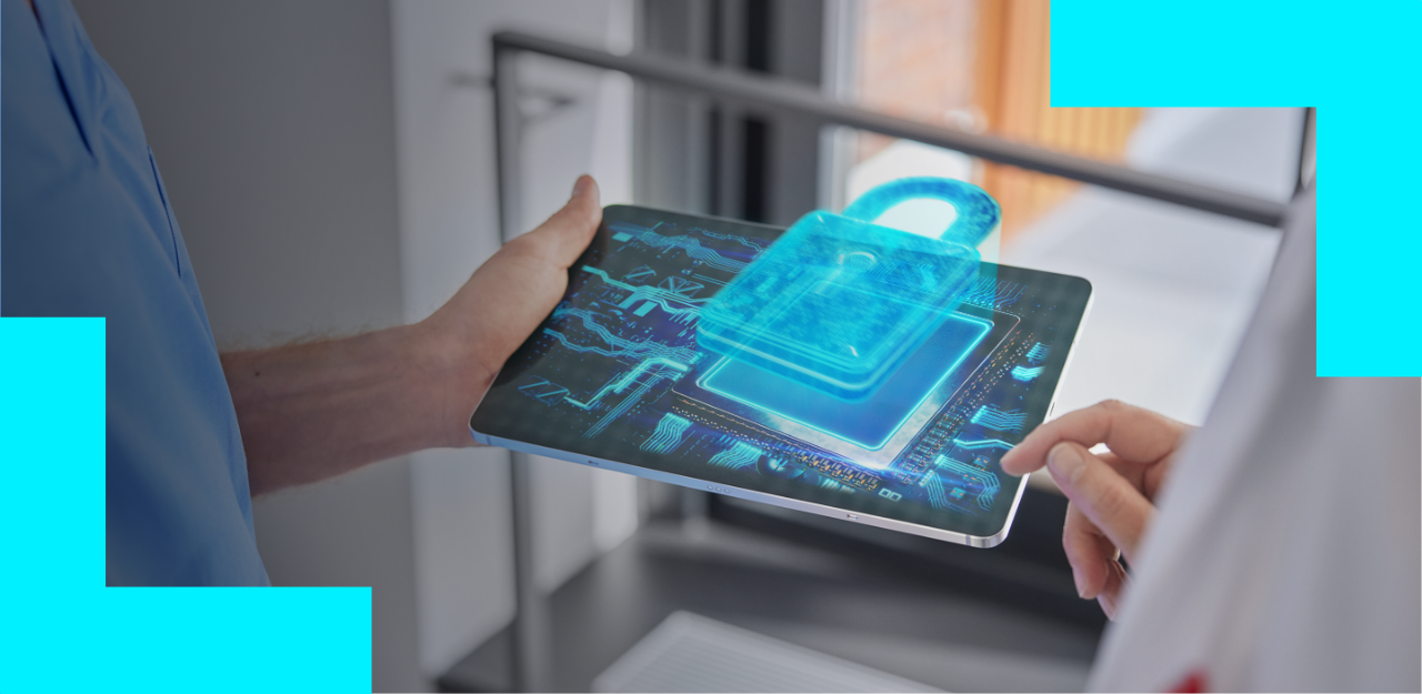 Healthcare workers holding a tablet  